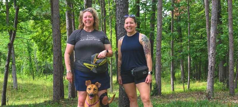 Hannah Ashmore and Sara Samborn with Kenna, a Michigan Conservation Dog trained to sniff out invasive spotted lanternflies.